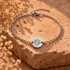 Silver-tone cancer awareness bracelet with round smiley face charm and link chain