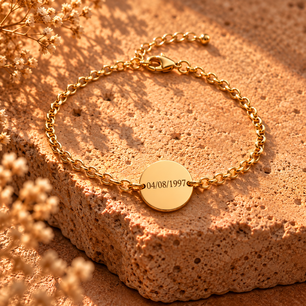 Gold-tone chain bracelet with round engraved date charm
