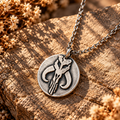 Silver round pendant necklace with mythosaur medallion and link chain